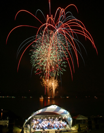 A fireworks display in Owensboro Kentucky, with an orchestra in the foreground.