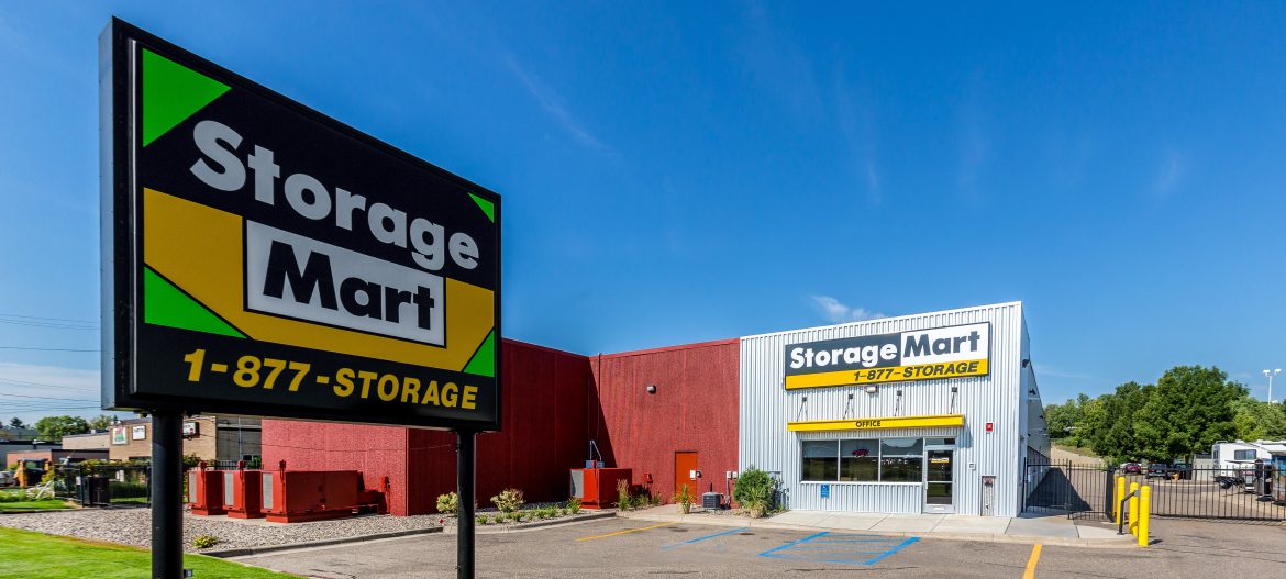 StorageMart sign in front of a storage mart building.