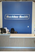Buckles-Smith logo on a wall behind a front desk.