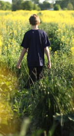 Cleveland, Tennessee. A person walking in a field.