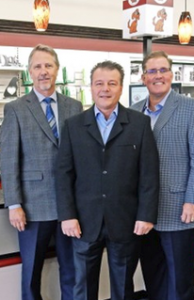 Global Pet Food. Three men standing in suits for a photo.