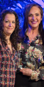 Women Presidents' Organization. Two women standing for a photo.