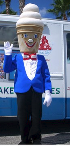 Mister Softee standing in front of an ice cream truck.