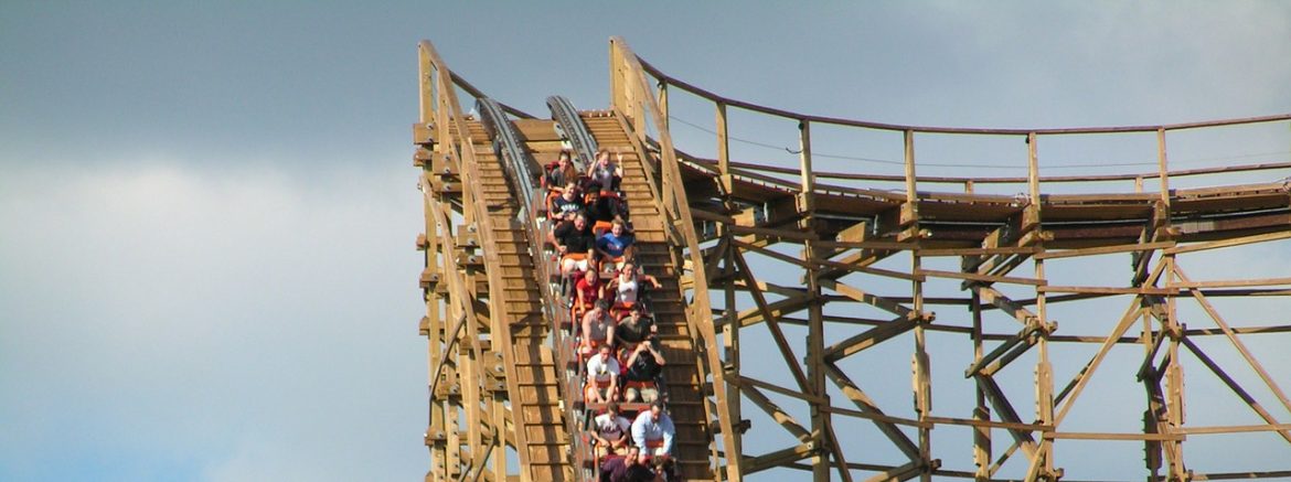 Riders start down a roller coaster drop.