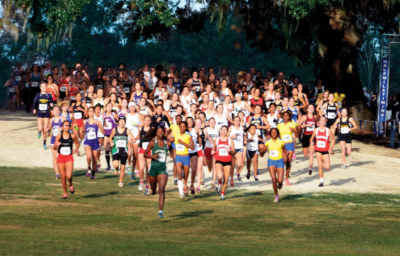 Leon County Florida, a large group of runners in a race wearing racing numbers going towards the camera.