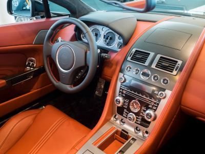 Michelman, interior cockpit of expensive sports car lined in leather and carbon fiber.