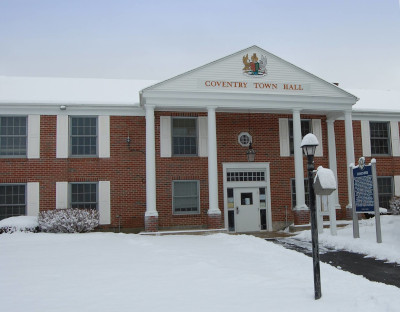 Coventry Connecticut Town Hall building with snow on the ground.