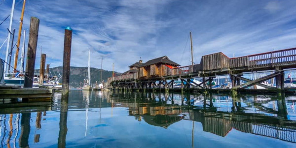 Cowichan Valley Regional District British Columbia; A pier on the right and docked boats on the left.