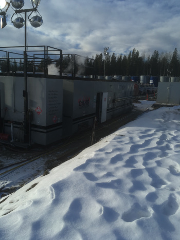 Perpetual Energy natural gas boilers with snow in front on the ground.