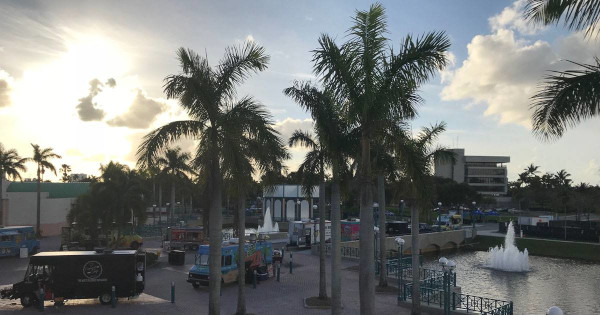 Sunrise, Florida public area with fountain and the sun shining.