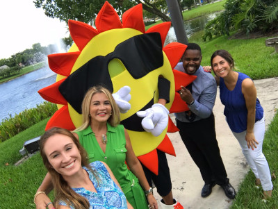 Sunrise, Florida sun posing with people for a photo.