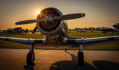 Las Cruces International Airport, military plane parked with the sun peaking over its nose.