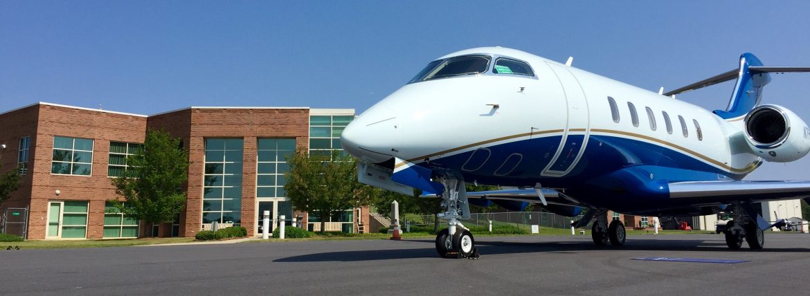 Rock Hill-York County Airport, a jet parked in front of the airport building.