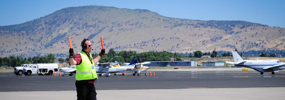 Crater Lake-Klamath Regional Airport, aircraft Marshall directing traffic.