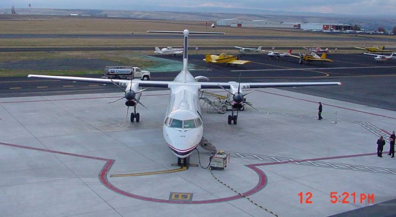 Lewiston-Nez Perce County Regional Airport, two prop plane in operation on the runway.