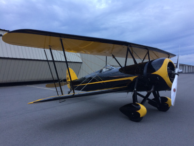 Murfreesboro Municipal Airport, a biplane near hangars.