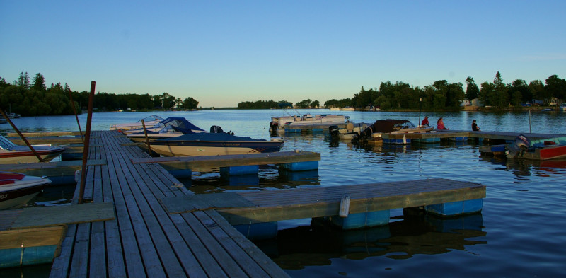 Rural Municipality of St. Andrew, Manitoba Chesleys Resort docks with boats and some people fishing.
