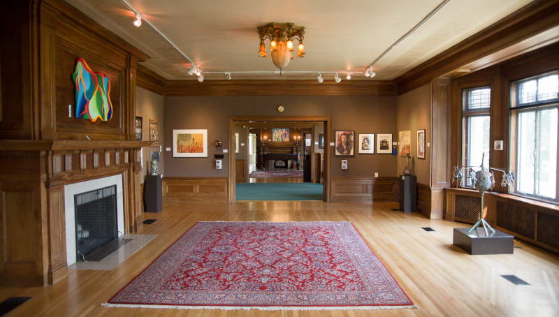 New Castle, Pennsylvania inside of a room with wood floors and a fireplace.