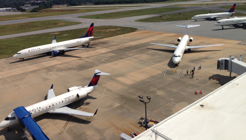 Columbus Airport outside with planes parked and arriving at the terminal.