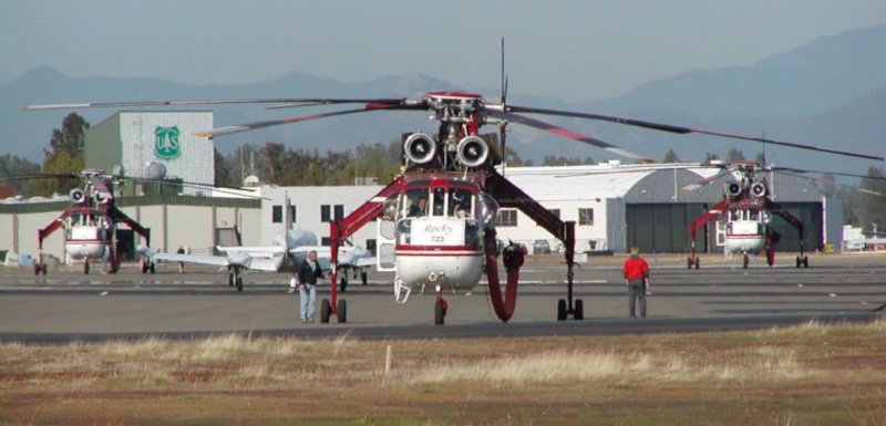 Redding Municipal Airport helicopters on runway.