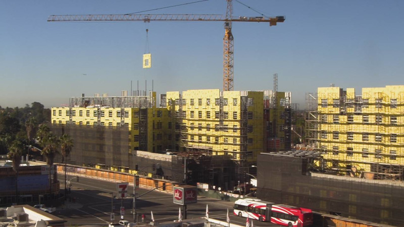 Superior Wall Systems building construction showing a large multi unit building and crane.