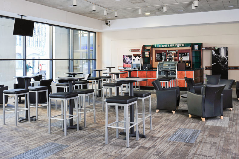 SeaGate Convention Centre, SeaGate Lobby interior with tall chairs and lounge chairs..