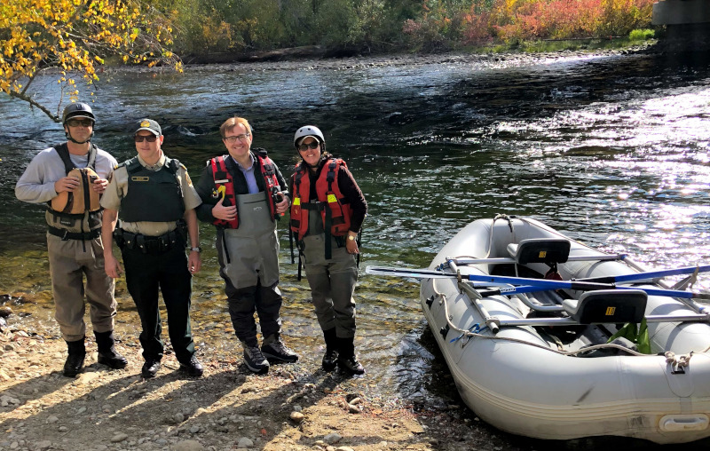 The Ministry of Fisheries, Oceans, and the Canadian Coast Guard Jonathan Wilkinson and others on a river with a raft next to them.