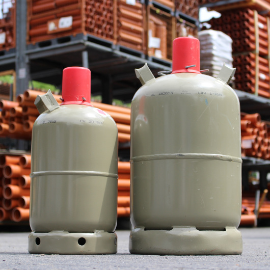 The Pressure Vessel Manufacturers Association, gas bottles sitting on the floor of a warehouse.