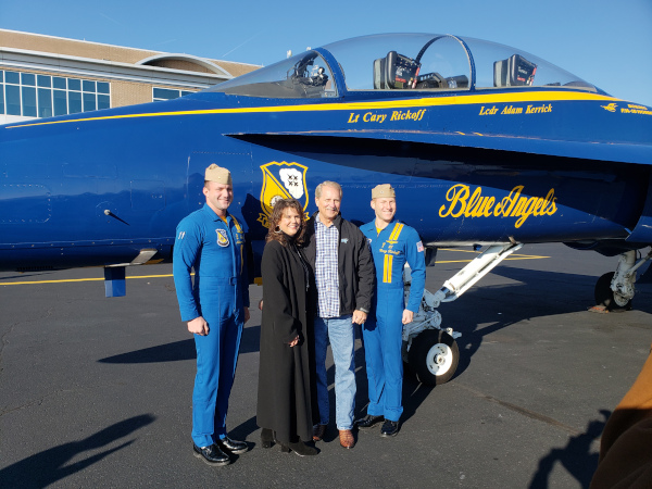 Rutherford County, Tennessee Mayor Bill Ketron with the blue angels navy pilots in front of a jet.