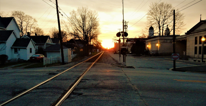 Wabash, Indiana railroad tracks going between houses at sunset.