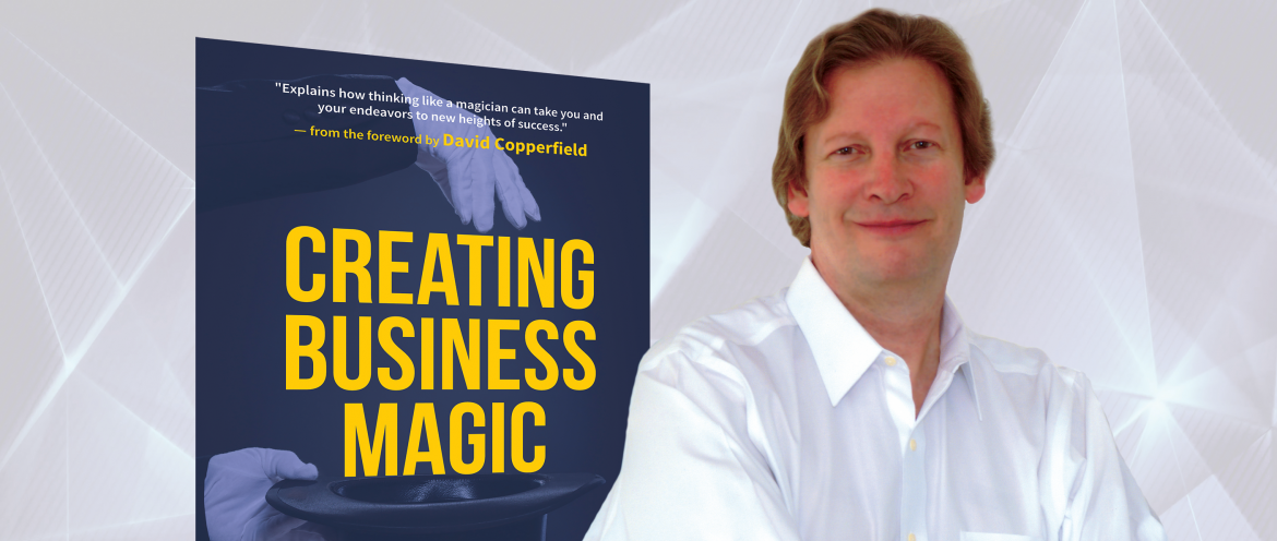 Creating Business Magic book cover with David Morey standing next to it.