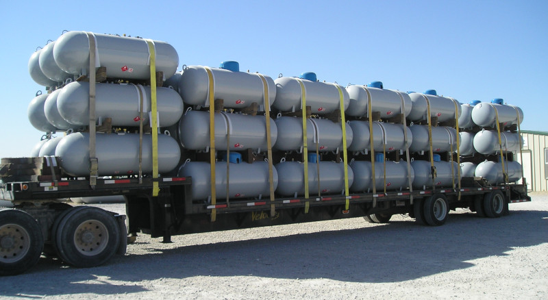 BLT Tanks semi trailer loaded with stacks of tanks.