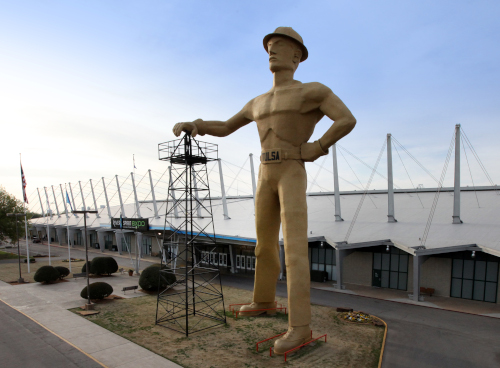 Expo Square Golden Driller man standing tall above the building.