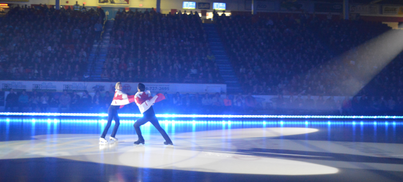 Keystone Centre ice rink with two figure skaters being watched by the crowd.