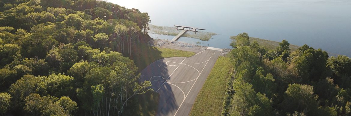 Leesburg International Airport aerial view of their new seaplane dock along the water.