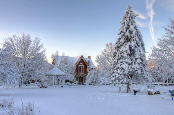 Mansfield, Massachusetts home in winter with everything covered in a layer of white snow.