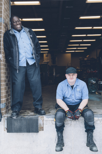 Overland Park Convention Center Full Time Staff showing two men sitting and standing in an entryway.