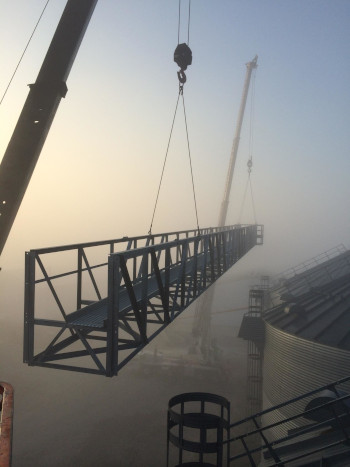 Pittsburg Tank & Tower Group lifting a catwalk through the fog in South America.