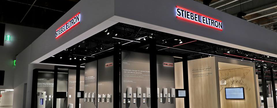 Stiebel Eltron showroom with examples of products behind glass windows.