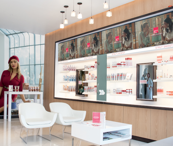 European Wax Center store interior showing items for sale on one wall of the store.