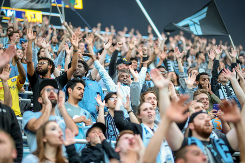 Allianz Field Stadium fans cheering on a soccer game.