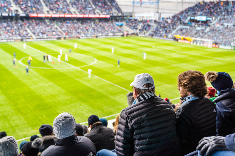 Allianz Field Stadium fans watching the game, view from behind them.