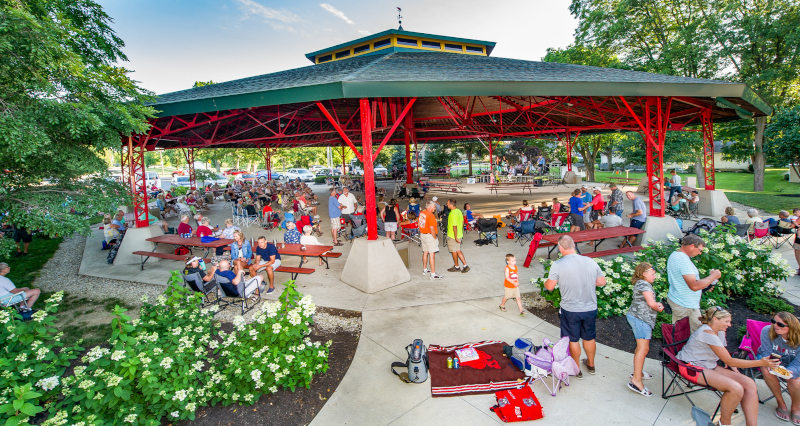 Auglaize County, Ohio park view with a lot of people at a covered area for an event.