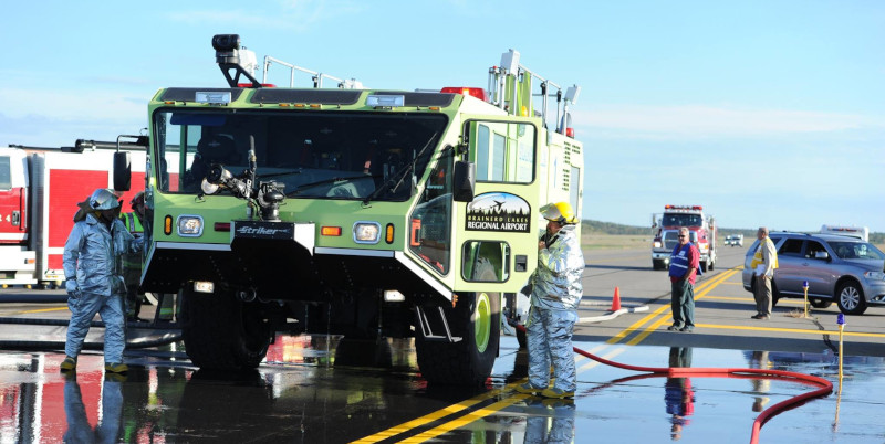 Brainerd Lakes Regional Airport first responders showing a Striker vehicle and persons wearing thermal equipment.