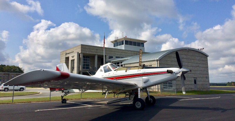 The Heart of Georgia Regional Airport building with a plane parked out front.