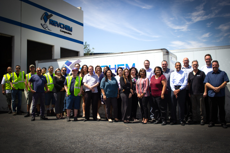 RevChem Composites group photos of employees outside their building in front of a truck.