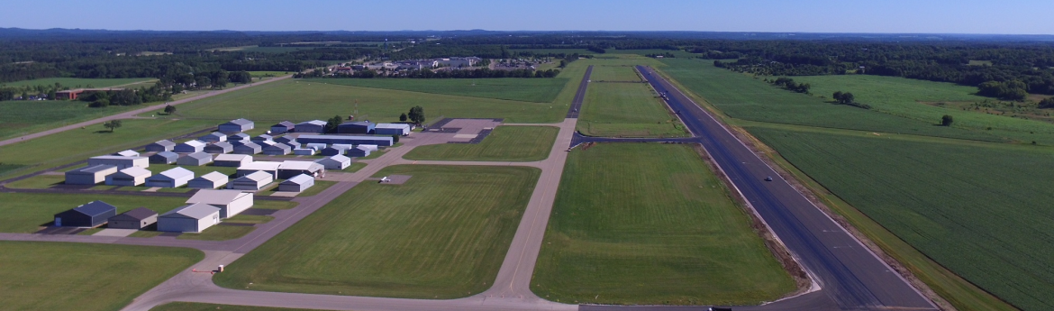 Baraboo-Wisconsin Dells Airport aerial view of runway and buildings.