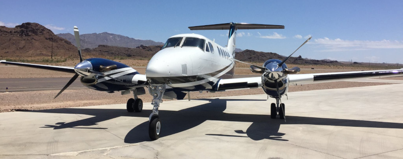 Lake Havasu City Airport, two prop airplane parked on runway.