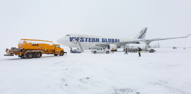 Prince George International Airport plane getting serviced in the snow.