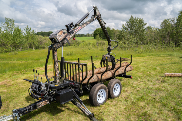 Wallenstein Equipment Inc. log loader and trailer.